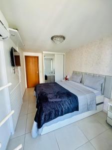 a bedroom with a large bed in a room at Resort Praia Grande in Arraial do Cabo +46 photos