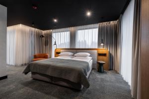 Ένα ή περισσότερα κρεβάτια σε δωμάτιο στο Hotel Kraft