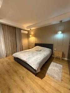 Ένα ή περισσότερα κρεβάτια σε δωμάτιο στο Fericire Cosmopolis