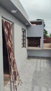 a facade of a building with an open door at Positiva 3 in Mar de Ajó