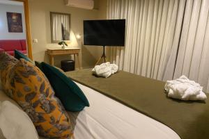 a hotel room with a bed with towels on it at BE ONE HOTEL Caldas da Rainha - by MHMB Hospitality in Caldas da Rainha +40 photos