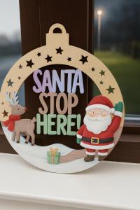 a sign that says santa stop here on a window at Linnhe View Fort William in Fort William