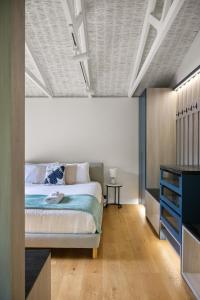 a bedroom with a large bed and a table at Treetop Retreat with Private Spa Mountain Views in Warburton