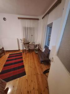 a living room with a table and a dining room at Σπίτι στο χωριό in Filýra +8 photos