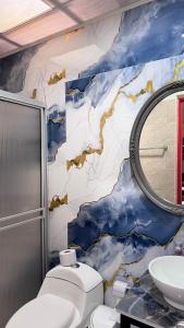 Ένα μπάνιο στο Apartahotel Bareque centro