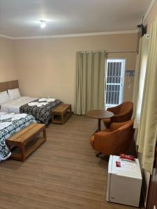 Postel nebo postele na pokoji v ubytování Pousada café em Flor