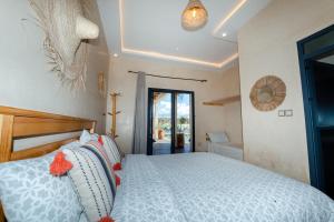 Postel nebo postele na pokoji v ubytování Kaouki Dream House + 31 fotografií