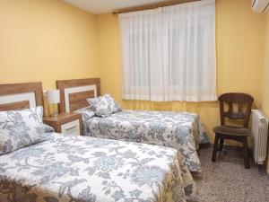 Ένα ή περισσότερα κρεβάτια σε δωμάτιο στο Magnifico