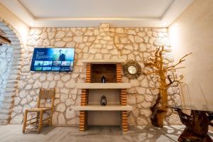 TV a/nebo společenská místnost v ubytování Kaouki Dream House