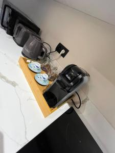 a kitchen counter with a toaster on a table at Appartement CFC in Casablanca