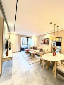 a living room with a couch and a table at Appartement CFC in Casablanca