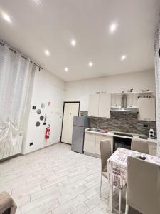 Kuchyň nebo kuchyňský kout v ubytování Il filo di Claudia + 7 fotografií