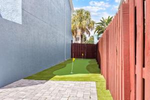 a miniature golf course in the middle of a building at Stylish Townhome w Hot Tub 5 Min Walk to Beach in Cape Canaveral