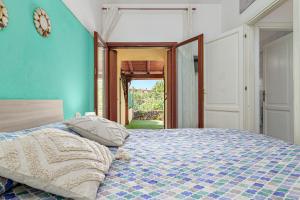 Ένα ή περισσότερα κρεβάτια σε δωμάτιο στο Villetta Via Tempio