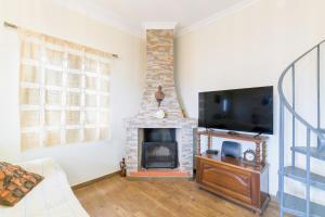 Μια τηλεόραση ή/και κέντρο ψυχαγωγίας στο Beach House - Casa de praia, Costa