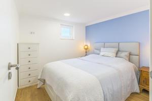 Ένα ή περισσότερα κρεβάτια σε δωμάτιο στο Beach House - Casa de praia, Costa