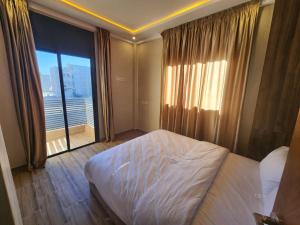 Ένα ή περισσότερα κρεβάτια σε δωμάτιο στο Appartement Aéroport Holiday