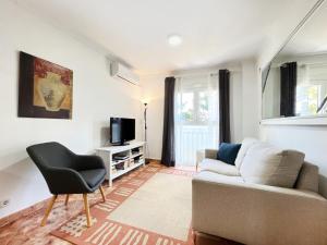 TV a/nebo společenská místnost v ubytování Almirall Playa