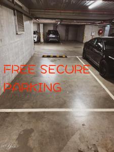 a parking garage with two cars parked in it at Trainer's Cozy Home - Town of Beginnings マサラタウンのトレーナーのおうち in Melbourne +26 photos