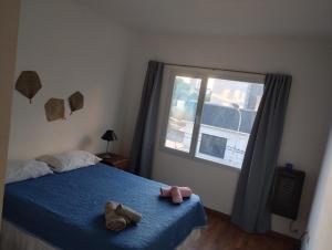 Voodi või voodid majutusasutuse Golondrinas Suites, depto céntrico con ascensor y cochera toas