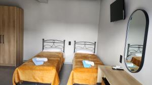 Ένα ή περισσότερα κρεβάτια σε δωμάτιο στο VILA NIKOLETA