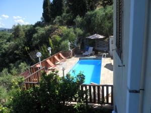 a view of a swimming pool from a house at Villa Rosi in Naso