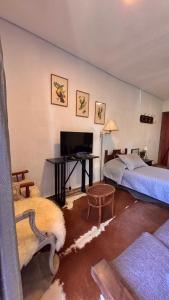 Кровать или кровати в номере Encanto das Araucárias II