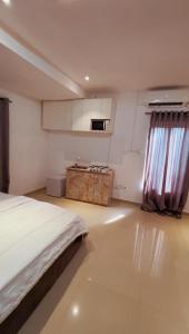 Ένα ή περισσότερα κρεβάτια σε δωμάτιο στο Swanky Spaces