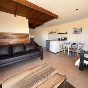 a living room with a couch and a table at Geko Apart Hotel in Mar del Plata
