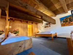 Postel nebo postele na pokoji v ubytování Ferienhaus Alpina Ötztal