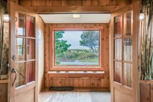an inside view of a tiny house with a window at The Tides in Seaside