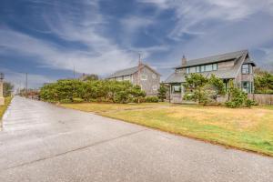 a large house with a driveway in front of it at The Tides in Seaside