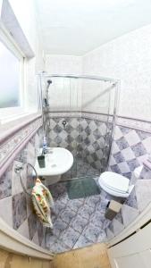 a bathroom with a sink and a toilet at Blue Sunrise in Birżebbuġa +19 photos