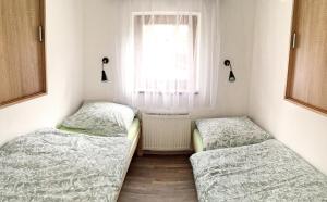 Ένα ή περισσότερα κρεβάτια σε δωμάτιο στο Beautiful, quiet apartment in the Boehm Switzerland +16 φωτογραφίες