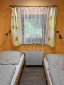 Ένα ή περισσότερα κρεβάτια σε δωμάτιο στο Beautiful, quiet apartment in the Boehm Switzerland