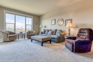 a living room with a couch and chairs at Rivers Edge at Bridgeport in Seaside