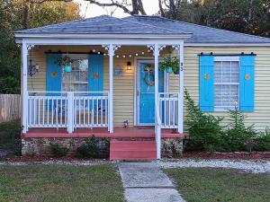 a small house with blue doors and a porch at The Lemon Zest Cottage Paws Welcome in Pensacola