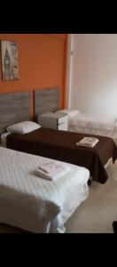 Ein Bett oder Betten in einem Zimmer der Unterkunft Musleh pousada