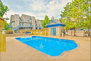 a large swimming pool in front of a house at Slopeside Loft at North Creek Resort in Blue Mountains
