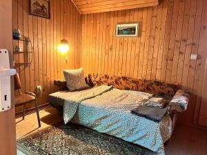 En eller flere senge i et værelse på Memory Lane Cottage – Posada