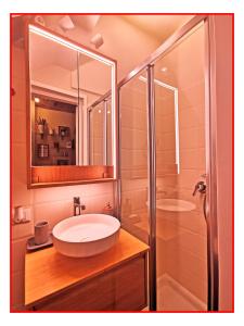 a bathroom with a sink and a shower at Casa GALILEO- Antiche Dimore Pisane in Pisa +11 photos