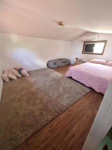 En eller flere senge i et værelse på Casa Sea Fox