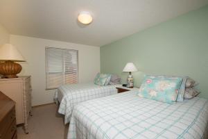 Ένα ή περισσότερα κρεβάτια σε δωμάτιο στο Family Tides in Seaside