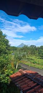 a view of a road with a mountain in the background at Cabañas Retiro Del Rio in Guayabal