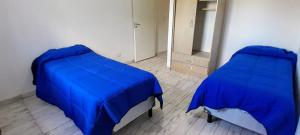 En eller flere senge i et værelse på Los Nogales Dep 2