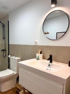 a bathroom with a sink and a mirror on the wall at Anahata Homes in Antigua +45 photos