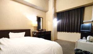 Ένα ή περισσότερα κρεβάτια σε δωμάτιο στο Hotel New Century Sakaide +36 φωτογραφίες