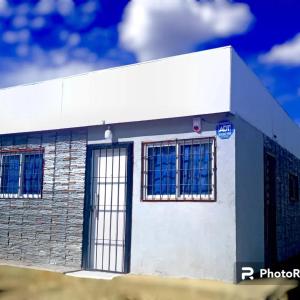 a white building with windows on the side of it at Mateo y Stella 3 in Bialet Massé