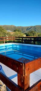a pool with a blue top on top of a deck at Mateo y Stella 3 in Bialet Massé