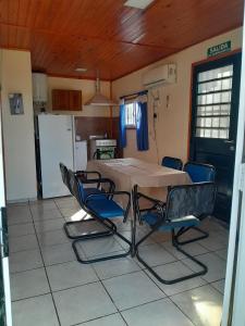a kitchen with a table and chairs in a room at Mateo y Stella 3 in Bialet Massé
